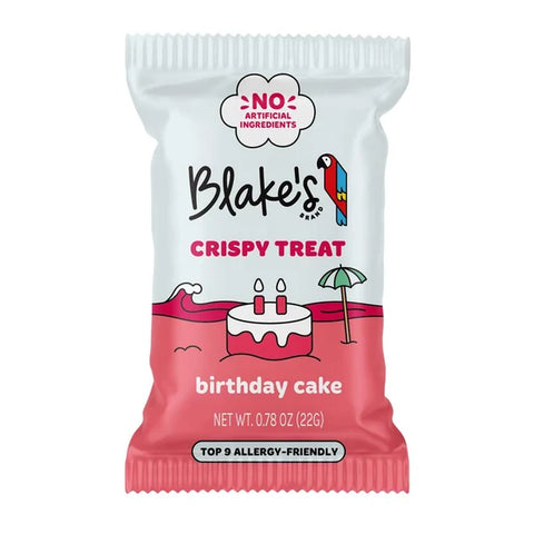 A single packaged snack bag for Blake's Brand Crispy Treats, flavor birthday cake. The packaging is white on top and pink on the bottom, featuring a cartoon illustration of a birthday cake with candles and a beach umbrella.