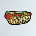 A sticker depicting a Chicago-style hotdog with the word 'Chicago' written in a cursive script on the bottom.